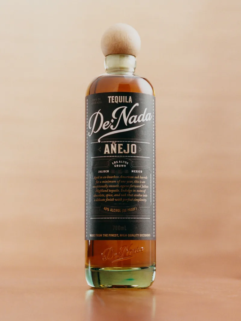 De Nada Añejo on a peach wall